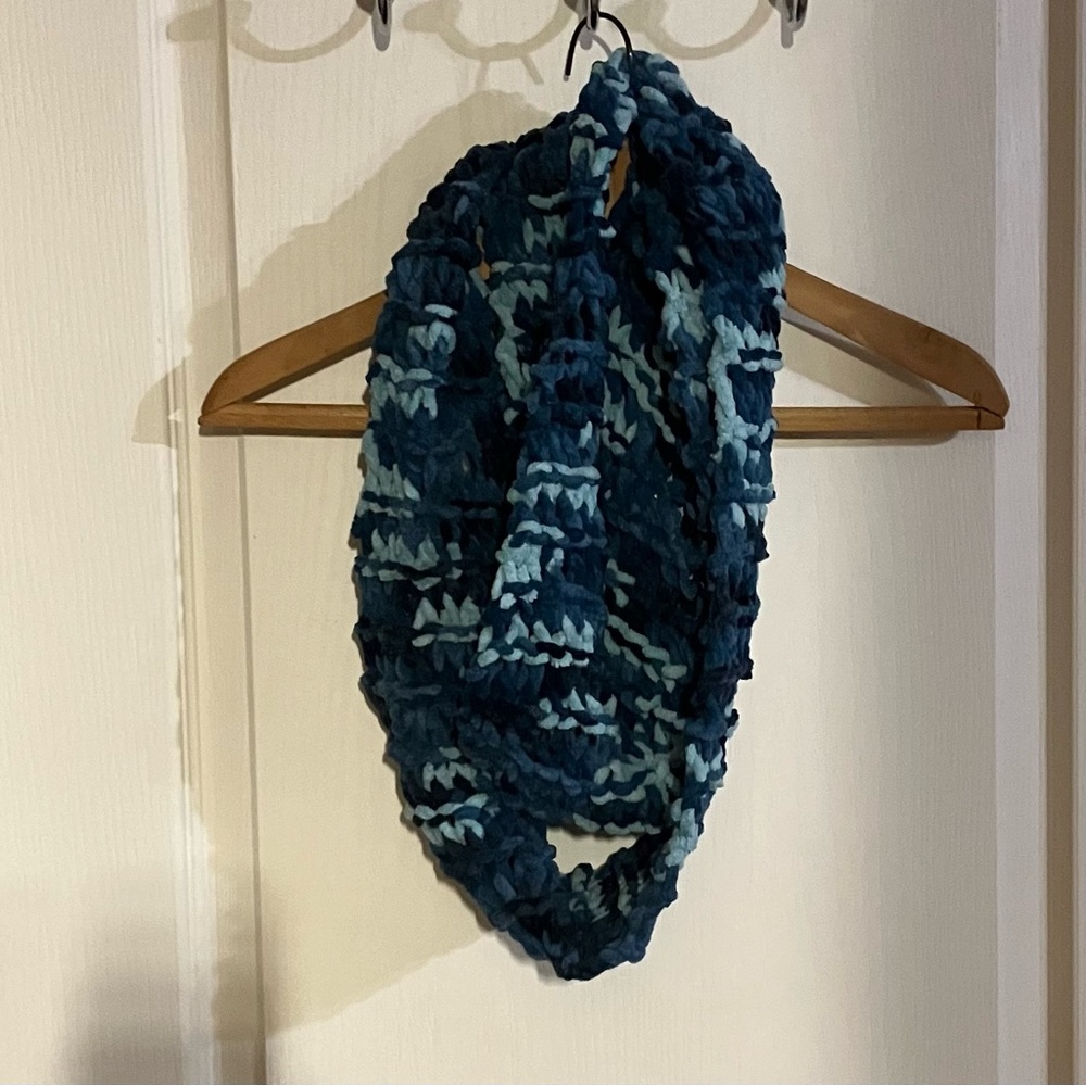 Your ultimate accessory is here. This is handcrafted infinity scarf;Blue shades.